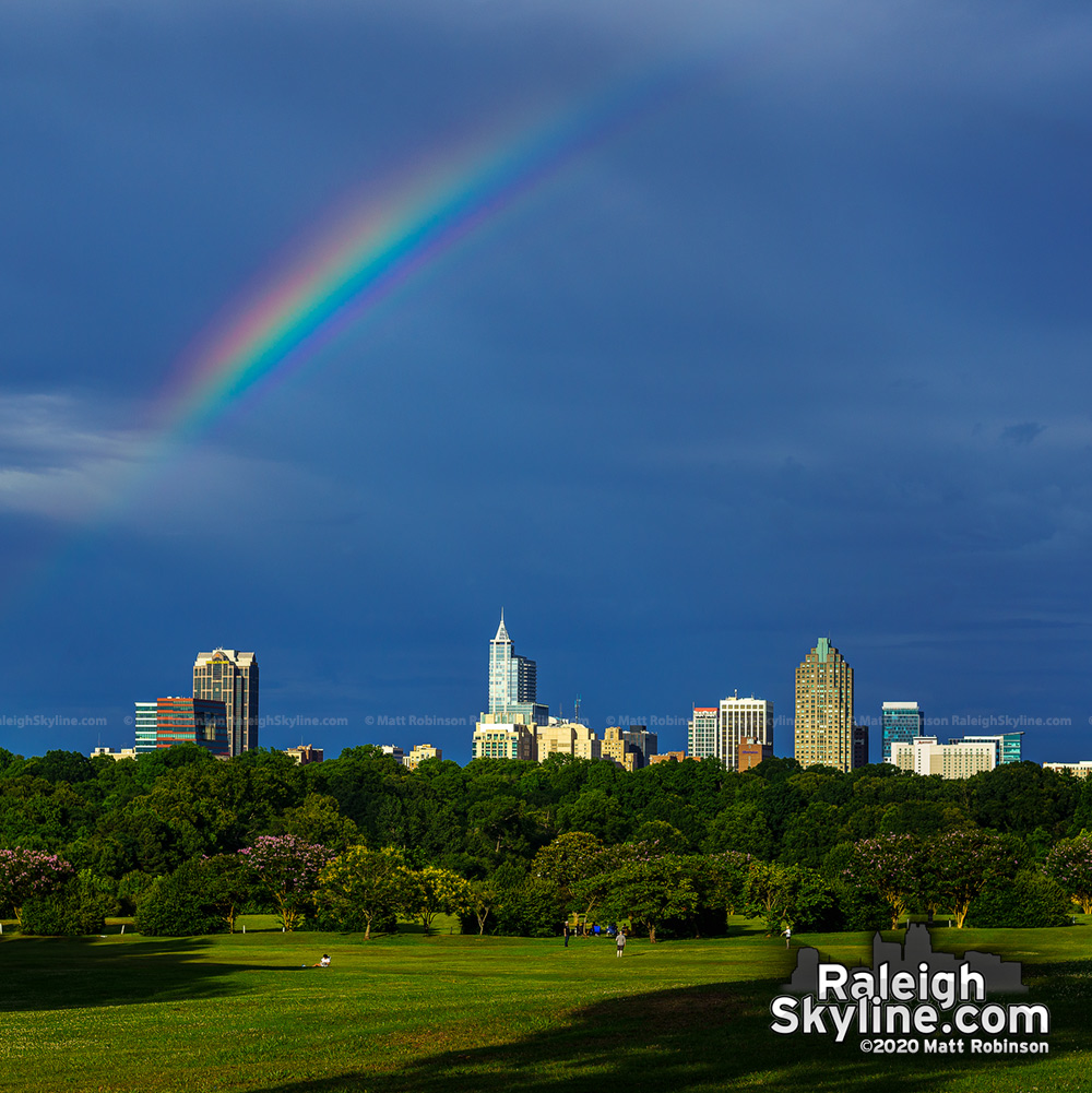 A partial rainbow streaks above Raleigh from Dix Park
