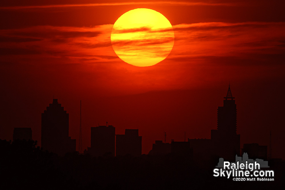 Disc of the Sun aligning over Raleigh from 7 miles away