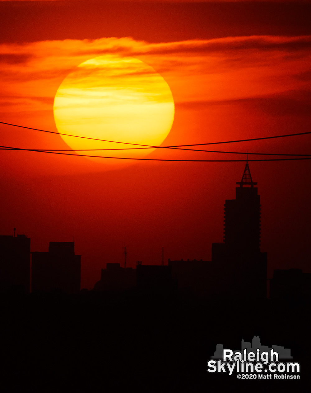 Disc of the Sun aligning over Raleigh from 7 miles away