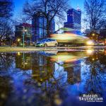 Melted snow leaves reflecting puddles at Moore Square 