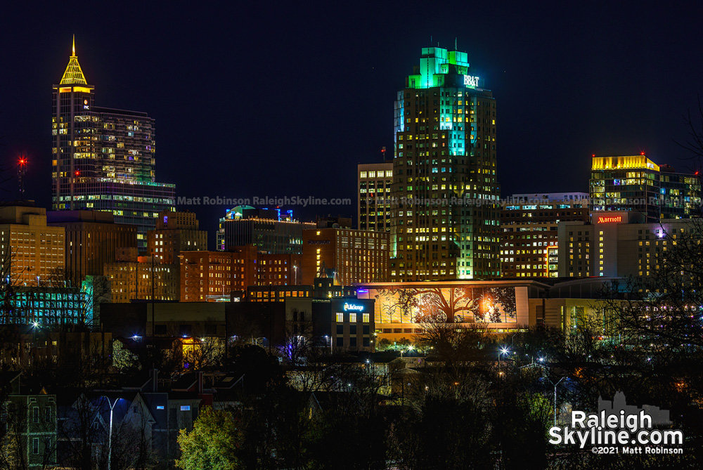 Downtown Raleigh buildings illuminated amber to remember the lives lost to Covid-19