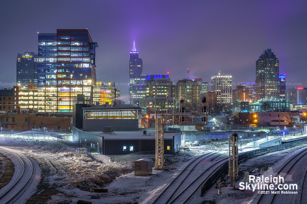 Snow accumulation with downtown Raleigh from Boylan Bridge