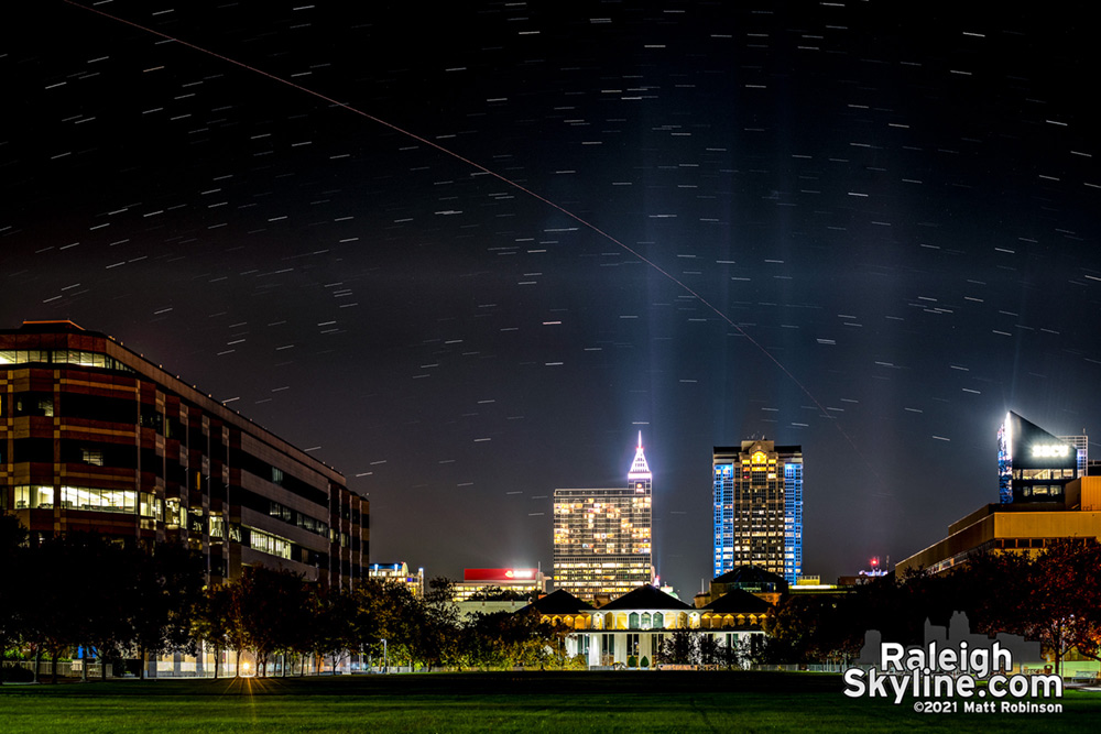 SpaceX Crew3 rocket streaks across the sky launching astronauts into orbit - visible over downtown Raleigh, North Carolina