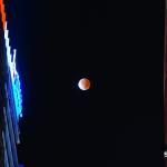 Lunar eclipse between Raleigh buildings