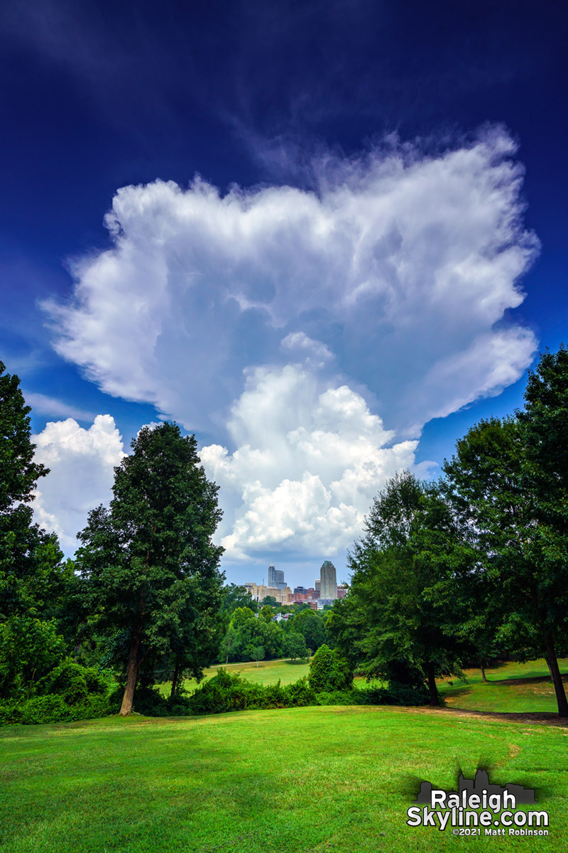 A mushroom cloud-like towering cumulus sprouting behind downtown Raleigh this afternoon. Heat index 106°, Friday the 13th August 2021