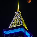 Total Lunar Eclipse with the spire of PNC Plaza lit in the colors of the Ukrainian Flag