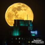 Moonrise behind the Truist sign on Two Hannover Sq