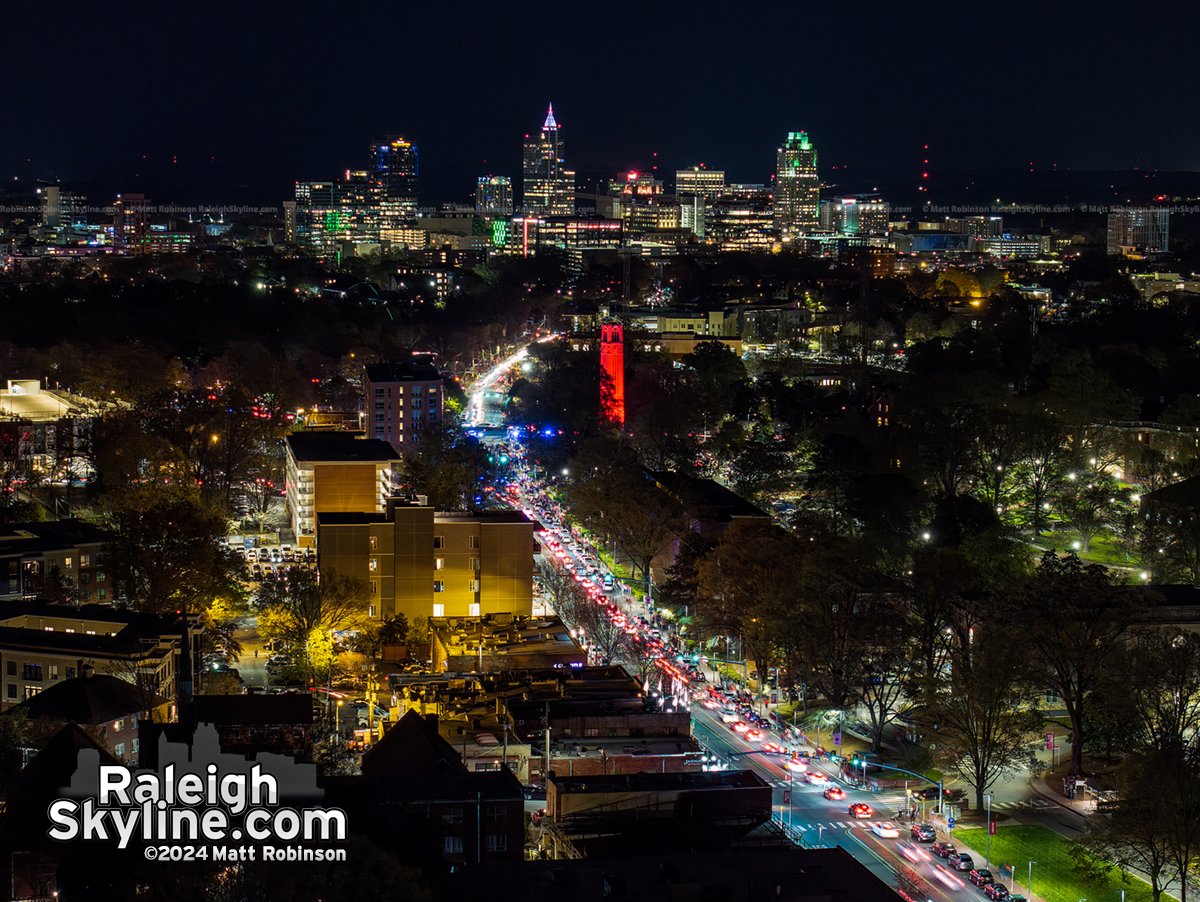 Wide view of Downtown Raleigh and the NCSU Bell Tower and Hillsborough Street lit up Red for Men's and Women's Basketball making the Elite 8