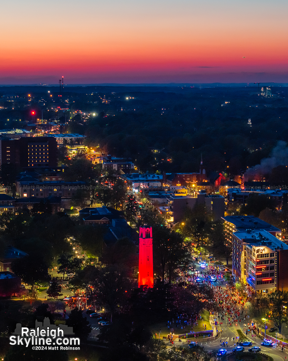 The NC State Bell Tower lit up Red at sunset for the Men's and Women's Basketball teams making the Final Four