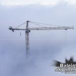 A crane for the new city hall rises out of the fog