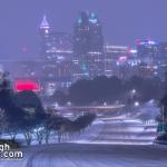 Downtown Raleigh at night with snow covered roads